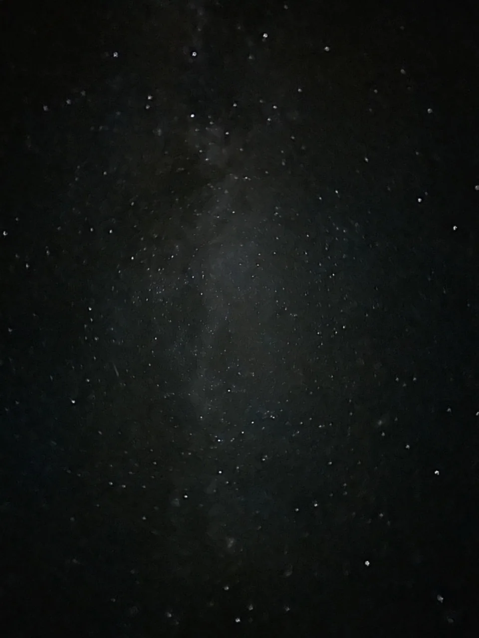 Vertical view of a dense star field and faint Milky Way