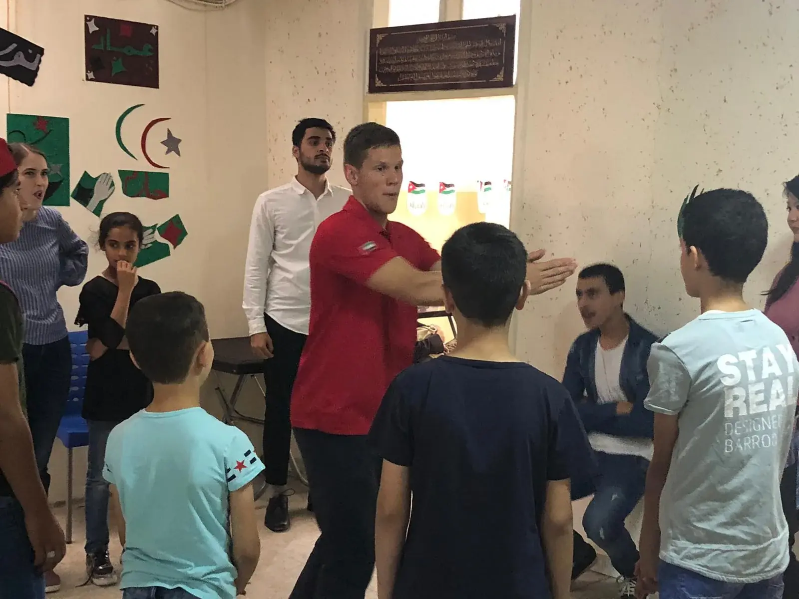 Children participating in an English activity with instructors in Jerash
