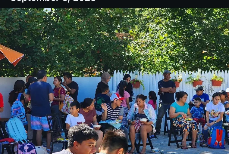 Families and children gathered outdoors at La Cocina 367 for a back-to-school event