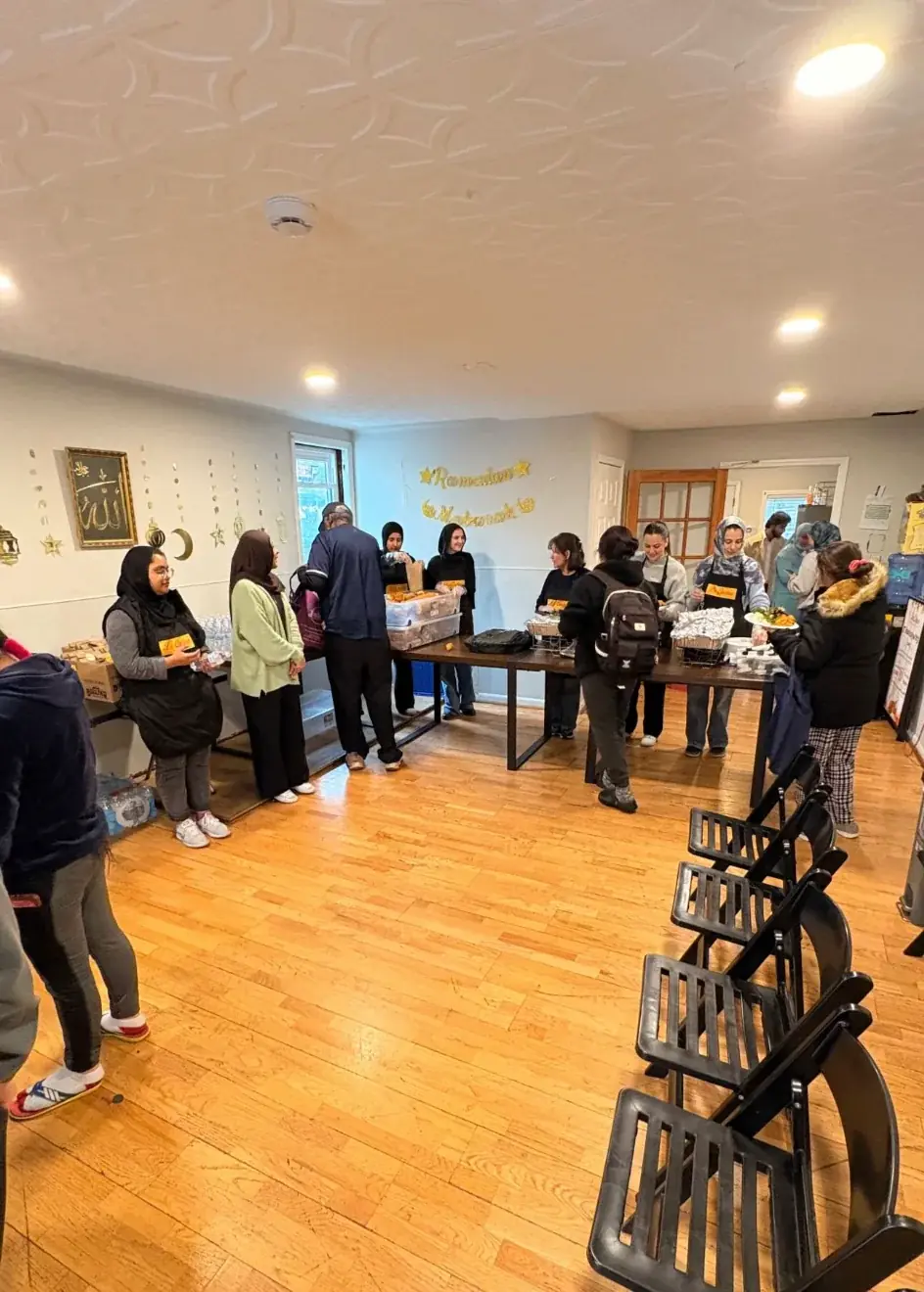 Volunteers arranging food inside La Cocina 367 for a community distribution
