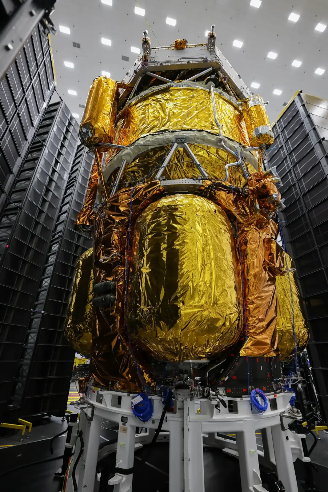 Close view of a gold-insulated lunar spacecraft structure inside a clean facility
